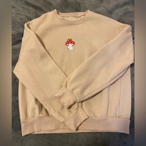 Cute little toad and mushroom crewneck! Size medium, slightly worn